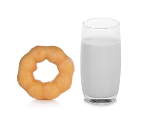 warm milk in the glass and donut on white background