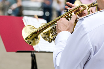 musician of military orchestra plays his trumpet
