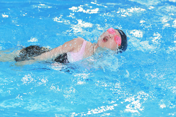 Happy girl in the pool