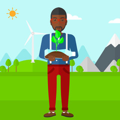 Man with plant growing in bottle.