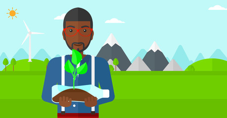 Man with plant growing in bottle.