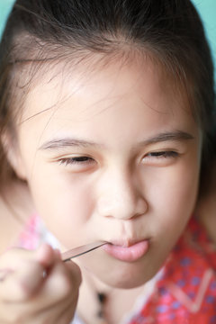 Little asian girl eating food