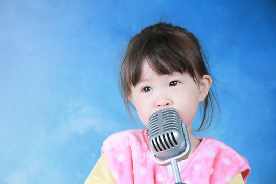 little girl with vintage microphone