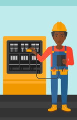 Electrician with electrical equipment.