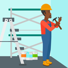 Fototapeta premium Constructor hammering nail.