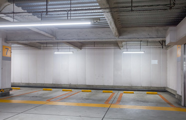 Empty space car park interior at night