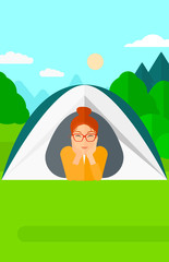 Obraz na płótnie Canvas Woman lying in tent.