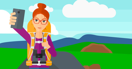 Backpckaer making selfie.