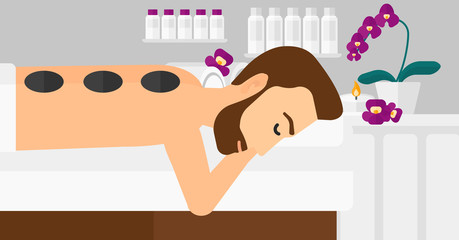 Man getting stone therapy.