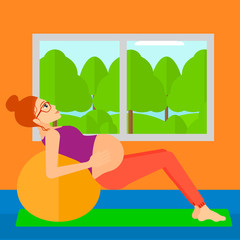 Pregnant woman on gymnastic ball.