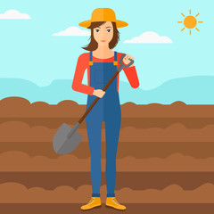 Farmer on the field with shovel.