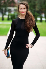 attractive lady in long evening dress on the street