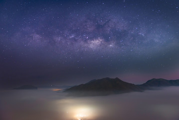 The skyline view and sunrise with the milky way at mountain with lot of fog at Phu Thok ChiangKhan Loei , Thailand.