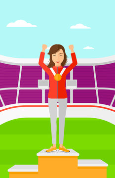 Athlete with medal and hands raised.
