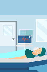 Patient lying in hospital bed with heart monitor.