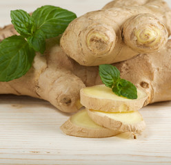 fresh ginger on wooden background