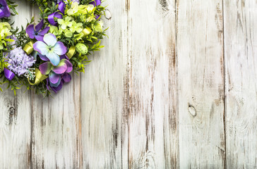 Easter decoration from easter eggs, easter boxwood and flowers.