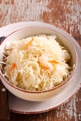 Pickled cabbage with carrots in a bowl