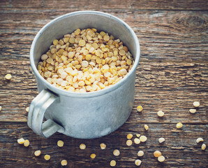 chick-pea a metal mug on wooden background