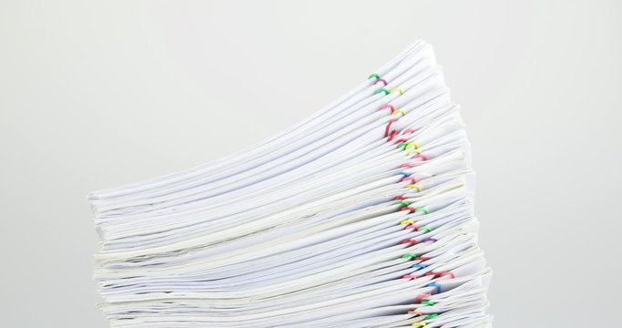 Stack paperwork overload on white table time lapse