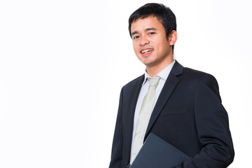 Young handsome man hold laptop in black suit smiling