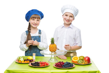 Children making fruit snacks