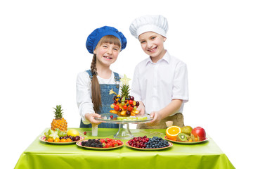 Children making fruit snacks