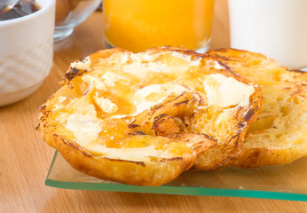 grilled croissant with butter and jam