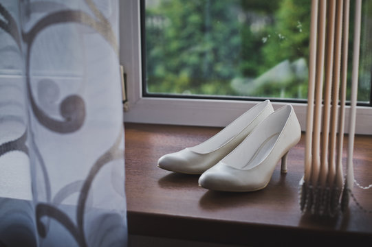 Beautiful white shoes on the windowsill 5193