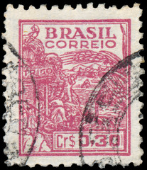 Stamp printed in the Brazil shows Wheat harvesting machinery