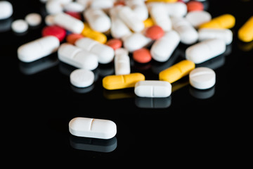 perspective view to drug pills on black background