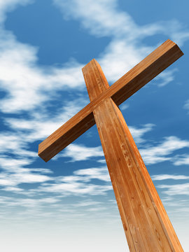 Conceptual wood cross or religion symbol over sky