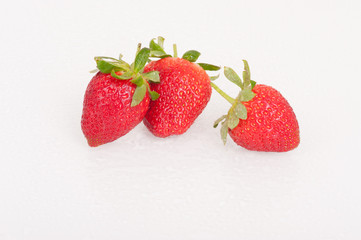 Strawberries, close-up on white background