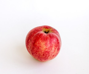Ripe summer red apple on a white background