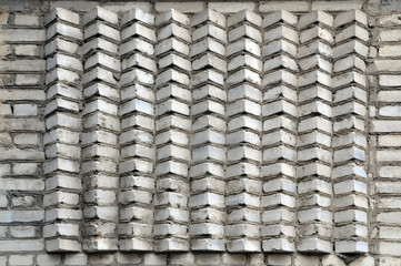 Wall texture of white silicate bricks laid at an angle