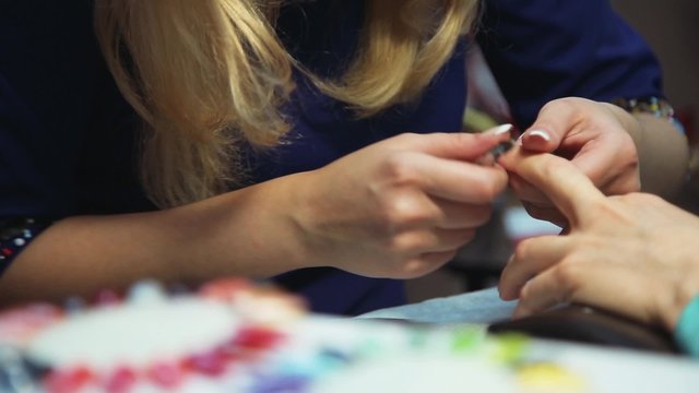 Manicure. The circumcision of the cuticle