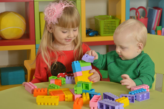 boy and  girl of playing with cubes