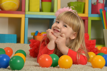Fototapeta na wymiar Portrait of little girl playing