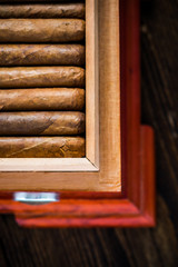 Overhead view on humidor with cigars