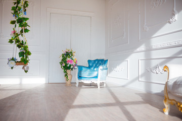 Vintage style chair in classical interior room with sunlight and  flowers