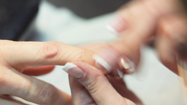 Treatment of the nails using a nail file
