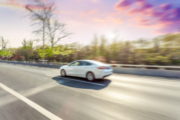 Plakat Car driving on road, motion blur