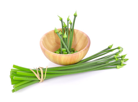 Onion flower and wooden bowl isolated on white background