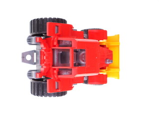 red toy tractor on a white background