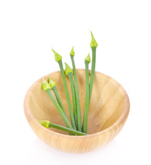Onion flower in wooden bowl isolated on white background