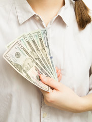 Woman hands holding dollar bills