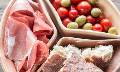 Jamon with bread and cherry tomatoes