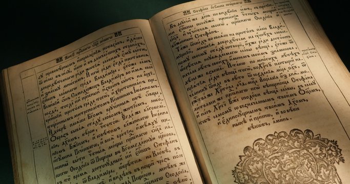 Old Book Paterik of Kiev-Pecherska Lavra Old-Slavic Style of Writing Engravings Pictures Episodes from the Life of Saints Monks Turning Pages of Book