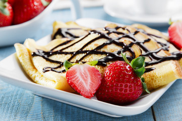 pancakes with strawberries and chocolate breakfast
