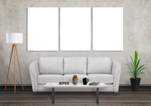 Mock up of three wall art canvas. Sofa, lamp, plant, glasses, book, coffee on table in room interior. 